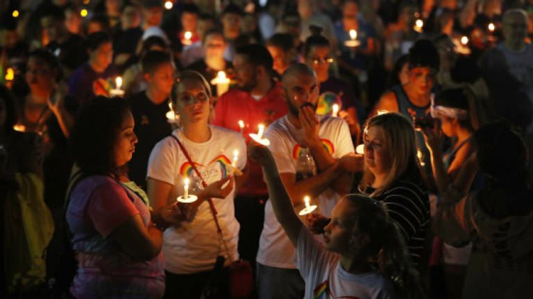 Hundreds mark first anniversary of Orlando mass shooting