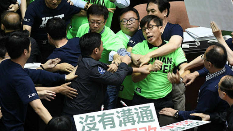 Taiwan lawmakers brawl over military pension cuts