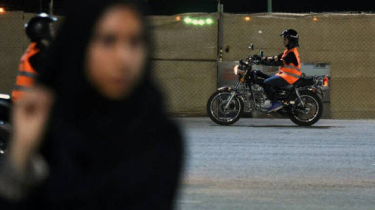 Saudi women rev up motorbikes as end to driving ban nears