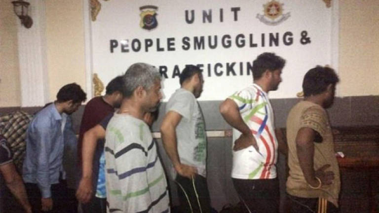 Afghan charged over smuggling asylum-seekers to Australia