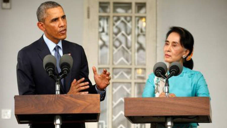 Obama calls new Myanmar president and Suu Kyi
