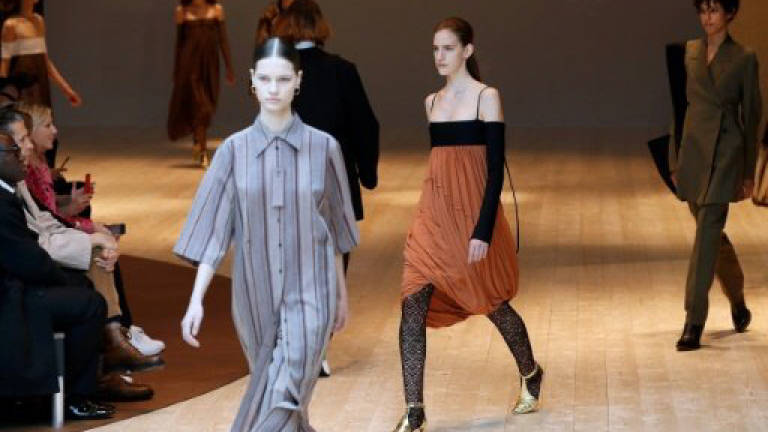 Balenciaga turns heads from models row with car mat skirts