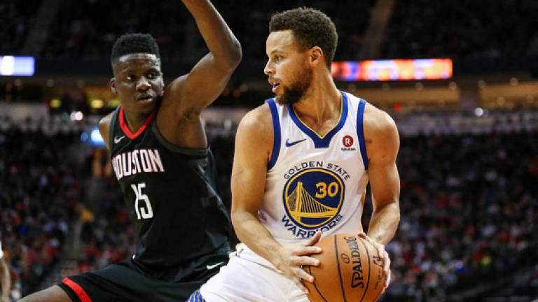 Warriors down Rockets in clash of Western powers