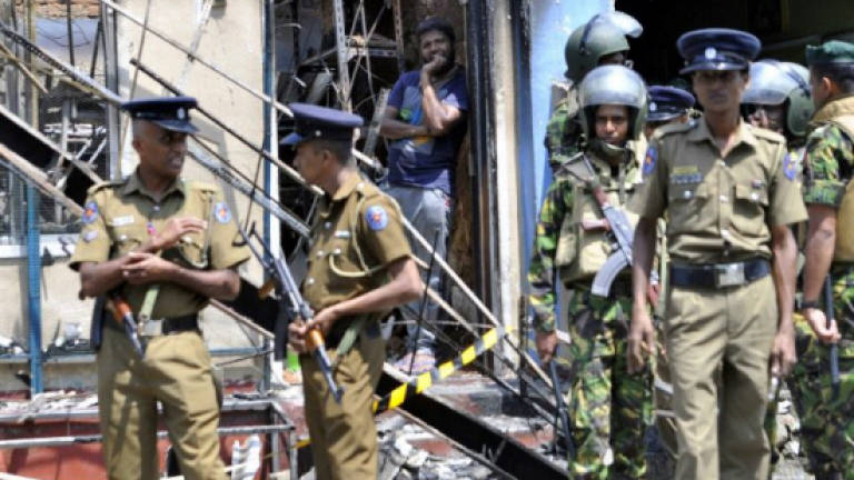 Sri Lanka to probe anti-Muslim riots, lift curfew