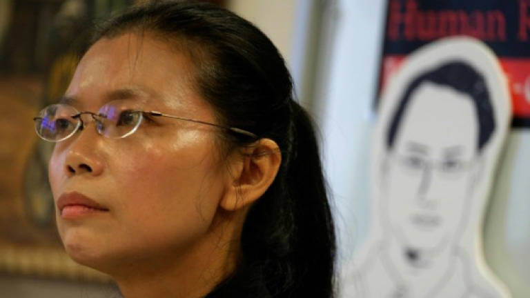 Wife of detained Taiwanese activist heads to China