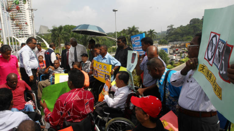 Disabled group march to Parliament to submit memorandum to Najib