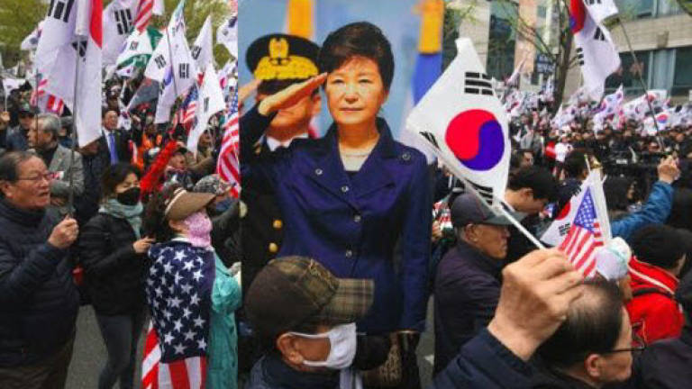S. Korea jails ex-spy chiefs for bribing former president