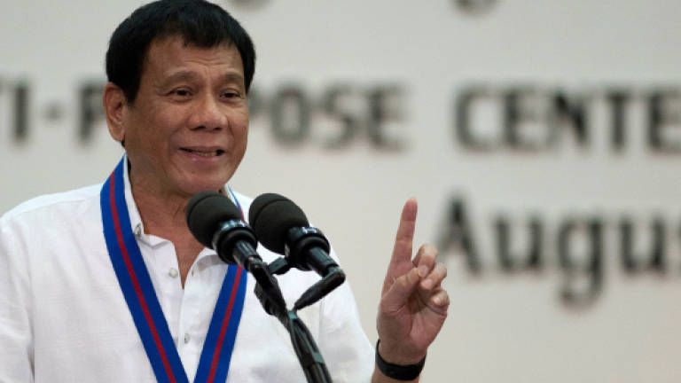 Philippines' Duterte pivots to China, Russia as investors flee