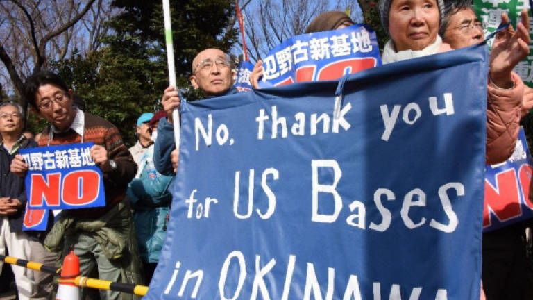 US returns tiny portion of controversial Okinawa base