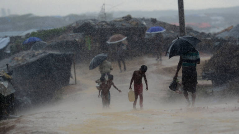 First monsoon rains pound Rohingya camps
