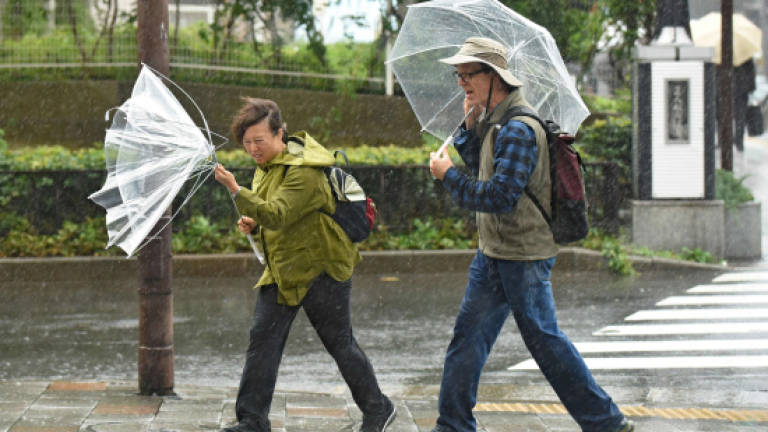 Typhoon leaves five dead after lashing Japan on election day (Updated)