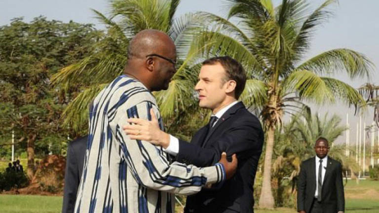On Africa tour, Macron vows to open files on Burkina hero