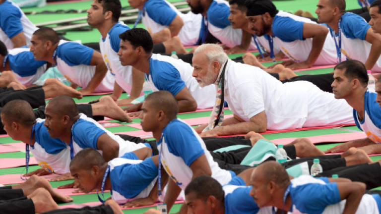 Millions stretch and bend as Indian PM leads world yoga day