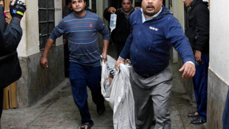Bangladesh firebombings kill nine amid pleas for calm