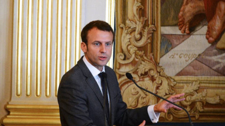 France's Macron edges towards presidential bid