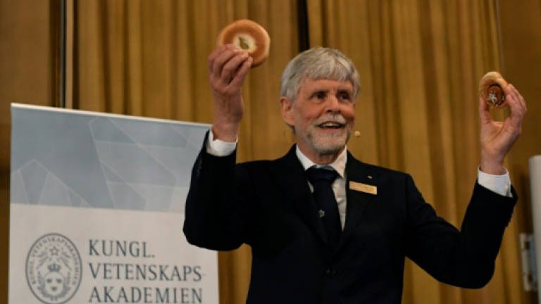 Bagels, pretzels, Boo! How to explain science Nobels