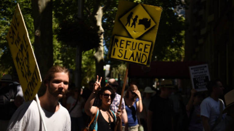 Activists superglue hands in Australia parliament protest
