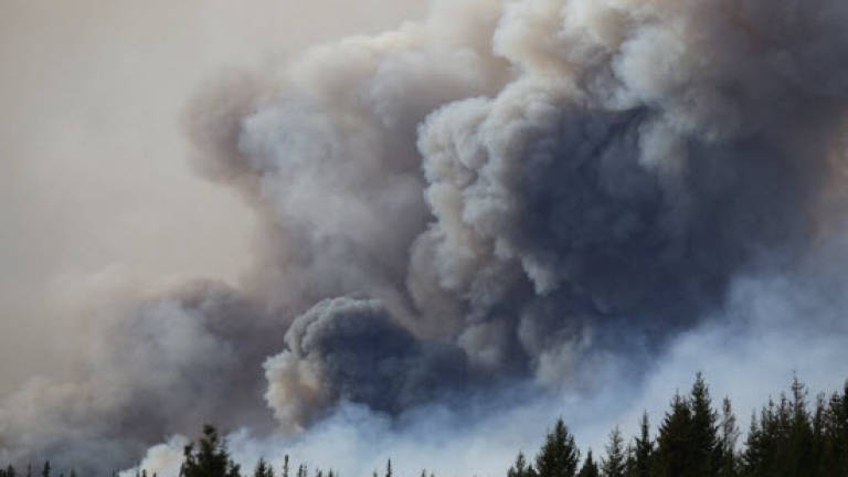 Contamination delays return for 9,000 Canada wildfire evacuees