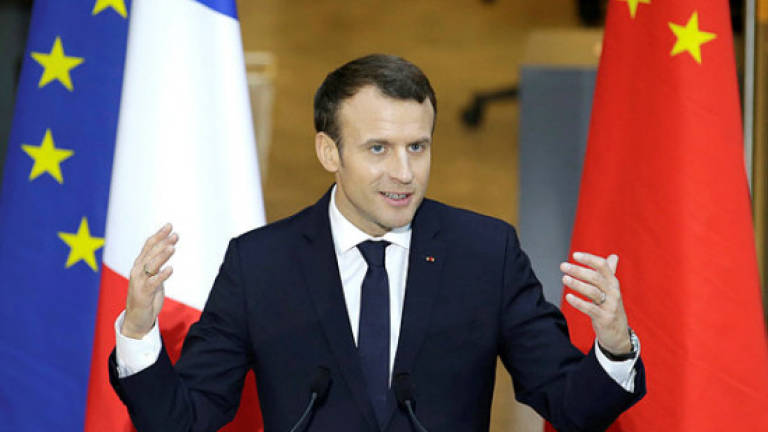 Macron wins Chinese fans with Mandarin lesson
