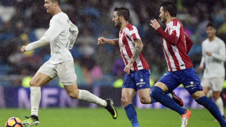 Ronaldo double extends Real lead, Sevilla up to second