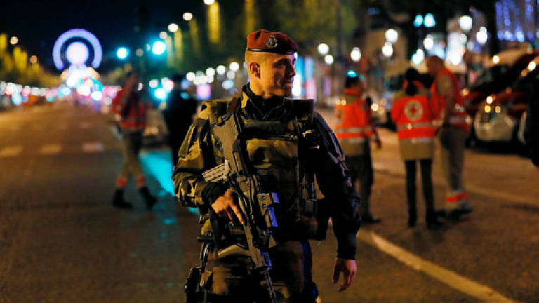 Islamic State claims Champs Elysees police killing