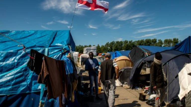 Migrants dice with death on Calais roads