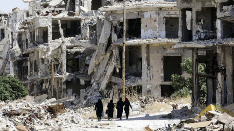Dozens dead in suicide attack in Syria's Homs