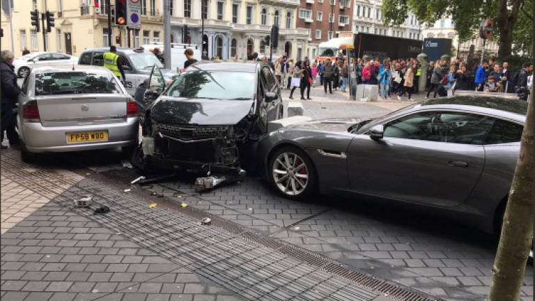 Man held after crash near London museum, 11 injured