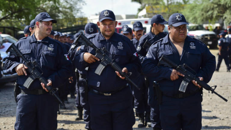 Mexico turns anti-cartel vigilantes into police force