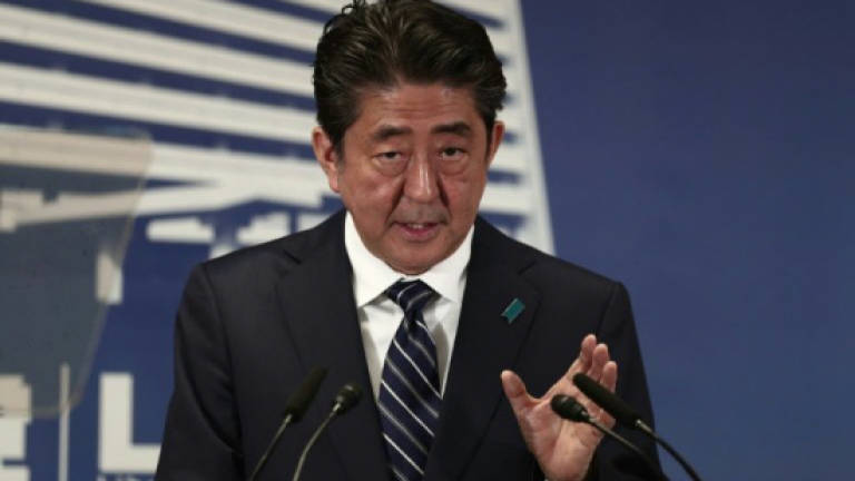Japan's Abe wins votes but not hearts