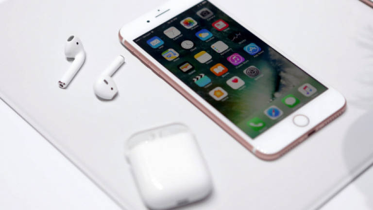 Apple makes splash with waterproof iPhones
