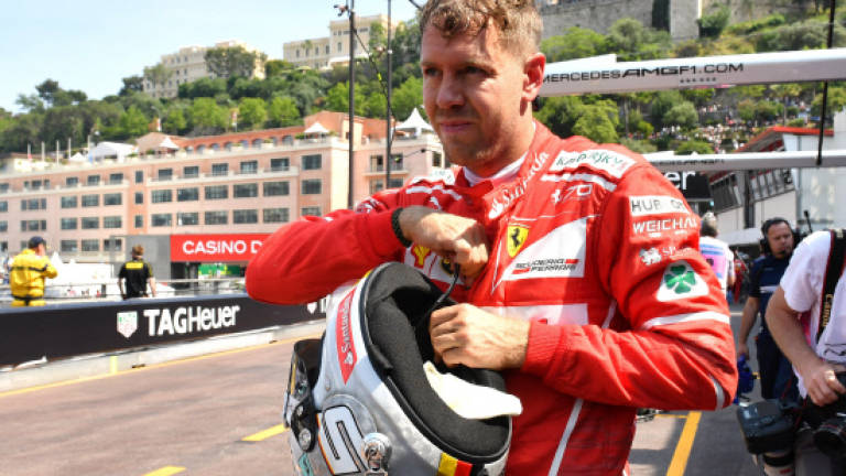 Vettel flies in Monaco but Hamilton labours