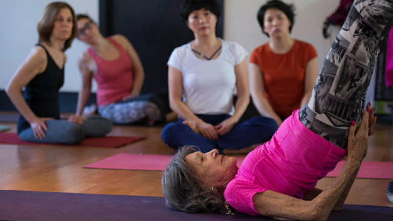 Tao, 98-year-old poster child for yoga and wellness