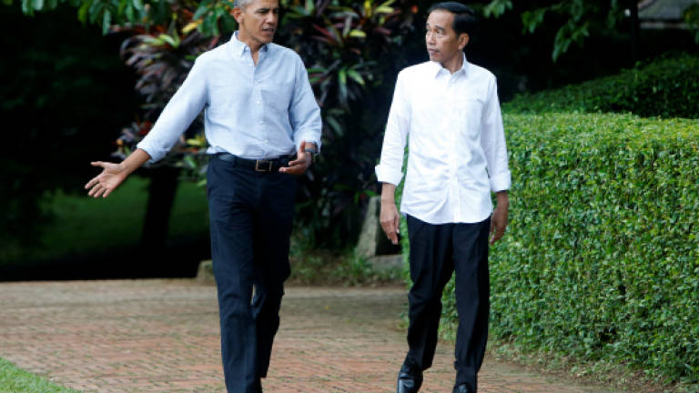 Obama urges end to division in childhood home Indonesia