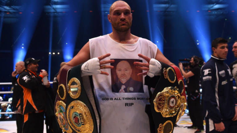 Fury vacates world heavyweight titles