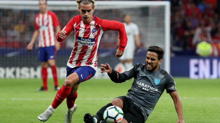Griezmann saves Atletico blushes, Barca 7 clear of Madrid