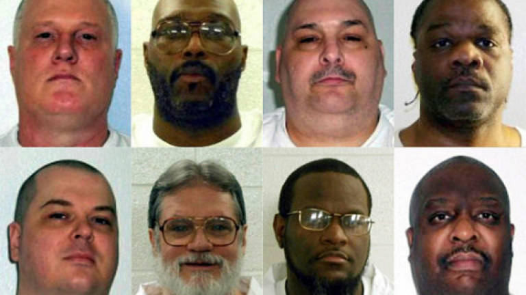 Arkansas puts first killer to death in planned double execution
