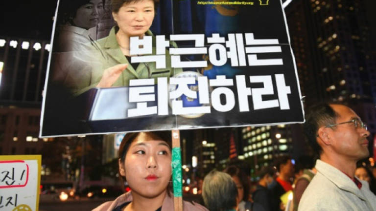 S. Korean president struggles to contain scandal