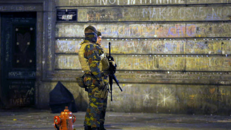 Belgium charges airport suspect, calls off Brussels 'march against fear'