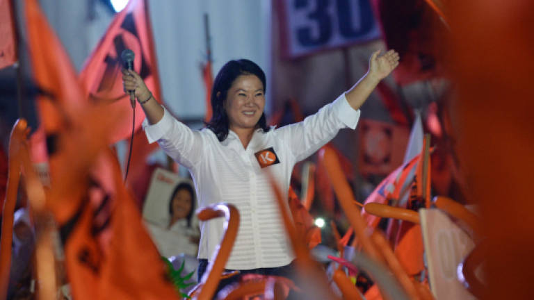 Peru mulls dark past as Fujimori daughter leads vote polls
