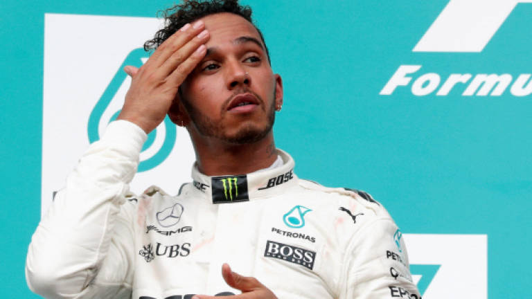 'Lucky' Hamilton fears Ferrari backlash in Japan
