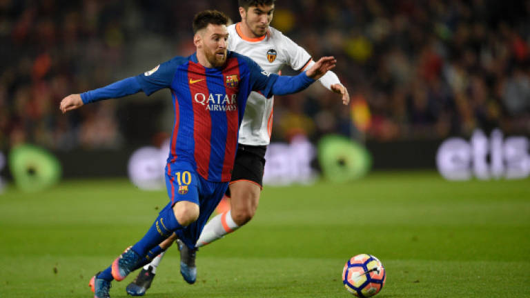 Messi double edges six-goal thriller Barca's way