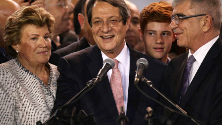 Cyprus president re-elected with eyes on new peace push