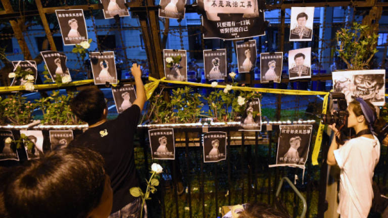 Student protester suicide deepens political row in Taiwan