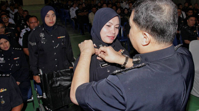 Dedicated policewomen perform duty tenaciously despite disabilities