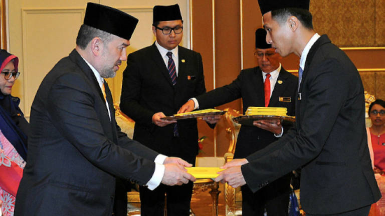 Agong gives out scholarships to 12 students