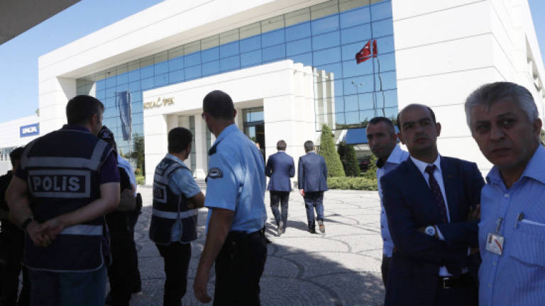 Turkey raids critical media group after British reporters jailed (Updated)