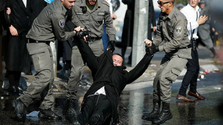 Ultra-Orthodox Israelis protest against army draft