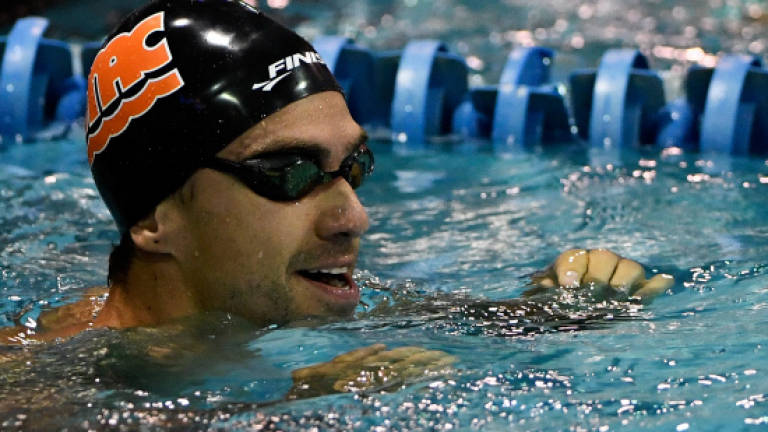 Former Olympic champ Ervin wins 50 free title