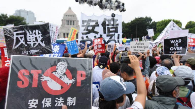 120,000 Japanese rally against military bills